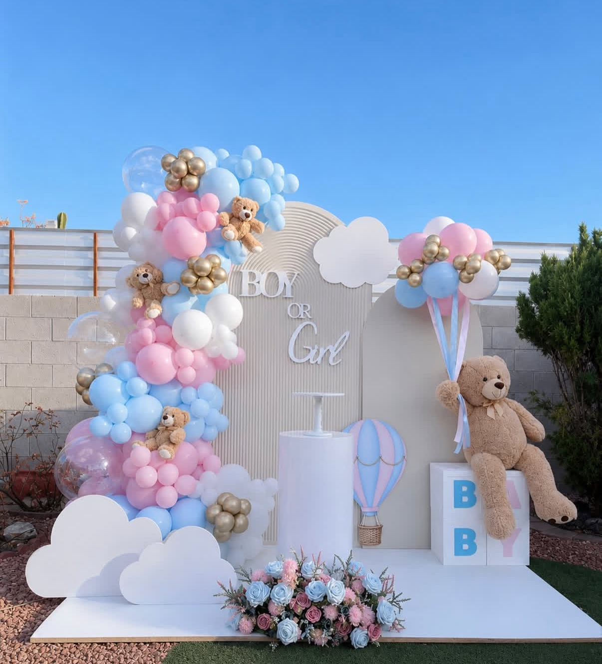 Boy or Girl gender reveal balloon arch with pink, blue and gold balloons, teddy bears and backdrop in Miami